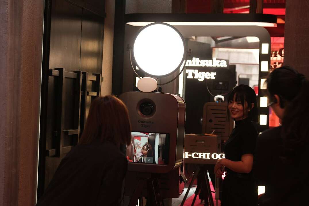 Camera operators working behind the scenes in a TV studio